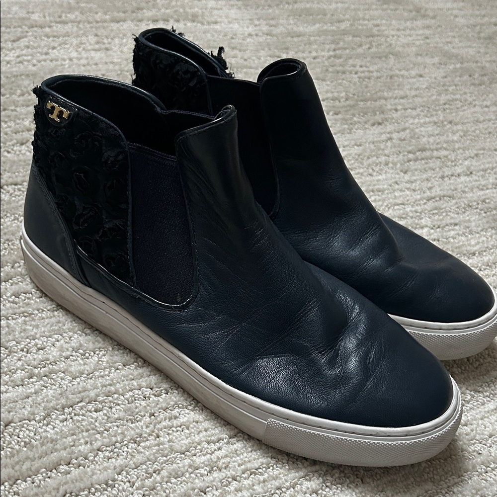 Women’s navy all leather high top sneaker. White sole